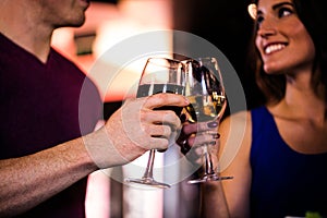 Couple toasting with a glass of wine