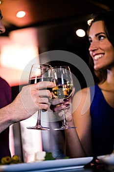 Couple toasting with a glass of wine