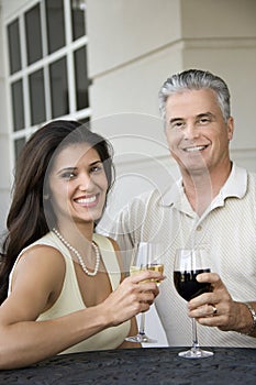 Couple toasting wine.