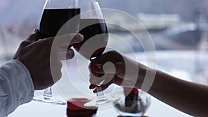 Couple toasting wine glasses close-up