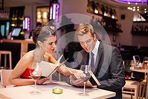 Couple together choosing meal