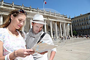 Couple with touristic map visiting