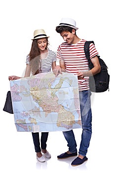 Couple of tourists looking destination on the map