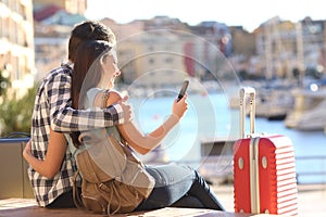 Couple of tourists searching on a smart phone