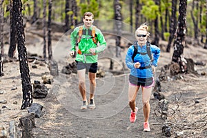 Couple trail running in forest