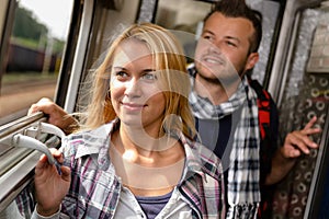 Couple in train looking out the window