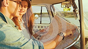 Couple Travel With Map In Car In Summer. Happy Smiling Young People.