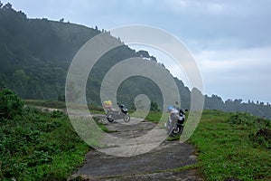 Couple A travel moped or scooter or motorcycle with luggage traveling along a mountain route in Vietnam. without people photo