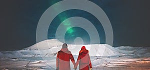 Couple Travelers enjoying Northern lights view