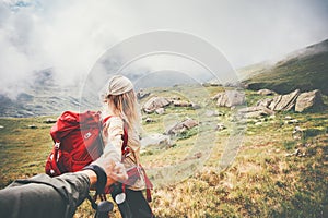 Couple travelers Man and Woman follow holding hands