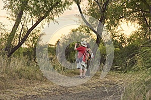 Couple of travelers at River of the Birds Park, in Colon, Entre Rios, Argentina