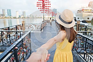 Couple Travelers visiting in Da Nang. Tourist sightseeing at love lock bridge. Landmark and popular. Vietnam and Southeast Asia