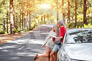 Couple traveling by car in the forest