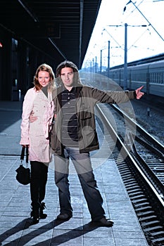 Couple traveling by trains
