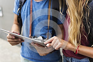 Couple traveling using tablet wanderlust