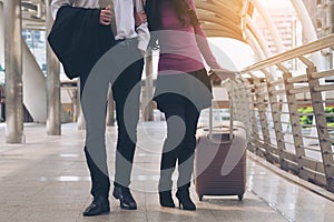 Couple travellers walking in airport walkway