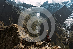 The couple travels through the Caucasus mountains. Couple in love in the Caucasus mountains. Man and woman traveling.