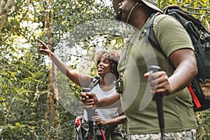 Couple trekking in the forest together