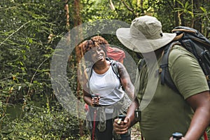 Couple trekking in the forest together