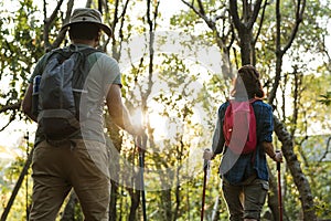 Couple trekking together in a forest