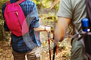 Couple trekking together in forest