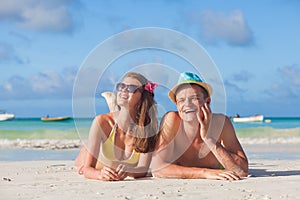 Couple on a tropical beach at Praslin island, Seychelles. Evening