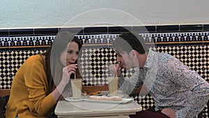 Couple trying horchata in cafe of Valencia