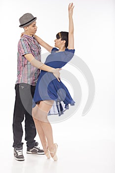 Couple of two dancers, woman on pointes, man with hat , on white background