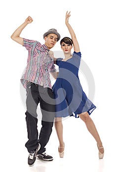 Couple of two dancers, woman on pointes, man with hat , on white background