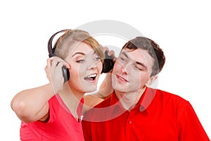 Couple two friends with headphones listening to music