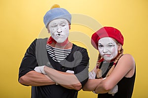 Couple of two funny mimes isolated on background