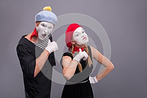 Couple of two funny mimes isolated on background