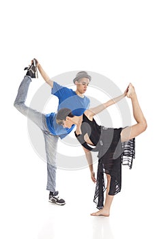 Two modern ballet dancers in dynamic action figure, on white background