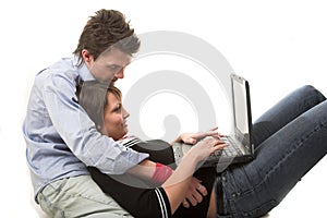 Couple typing at notebook