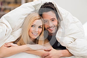 Couple under blanket