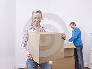 Couple unpacking boxes