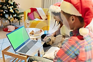 Couple use laptop during Xmas