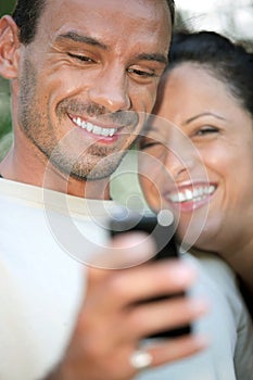 Couple using a cameraphone