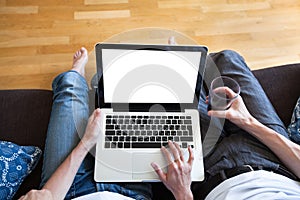 Couple using computer with empty screen