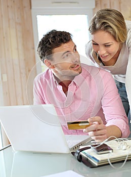 Couple using credit card shopping