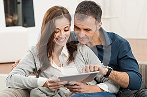 Couple Using Digital Tablet