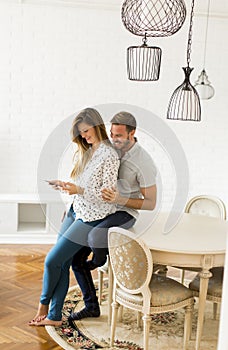 Couple using digital tablet together