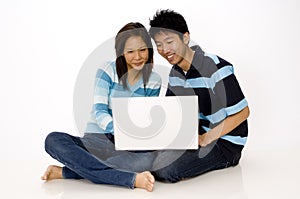 Couple using Laptop
