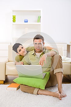Couple using laptop