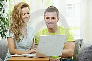 Couple using laptop computer