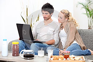 Couple using a laptop