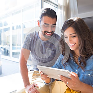 Couple using tablet