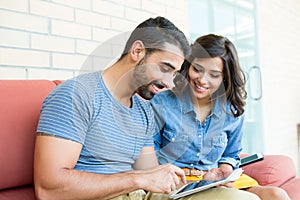 Couple using tablet