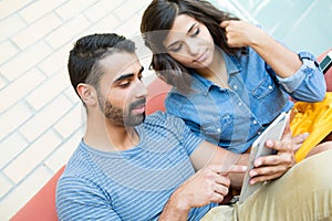 Couple using tablet