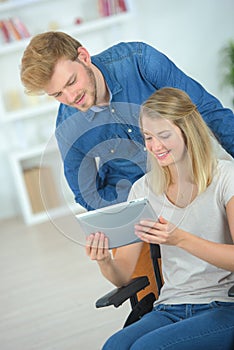 Couple using tablet computer